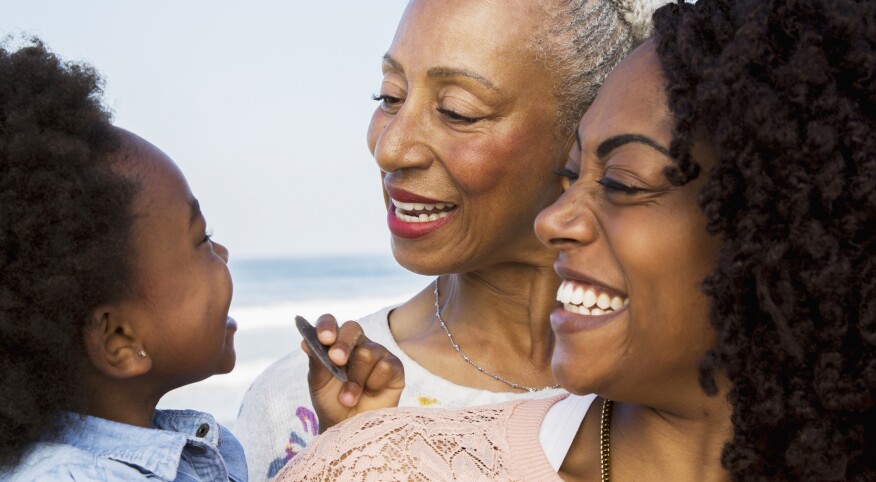 Sisters-grandmother-mother-baby-smiling-at-each-other-1540-GettyImages-905548688