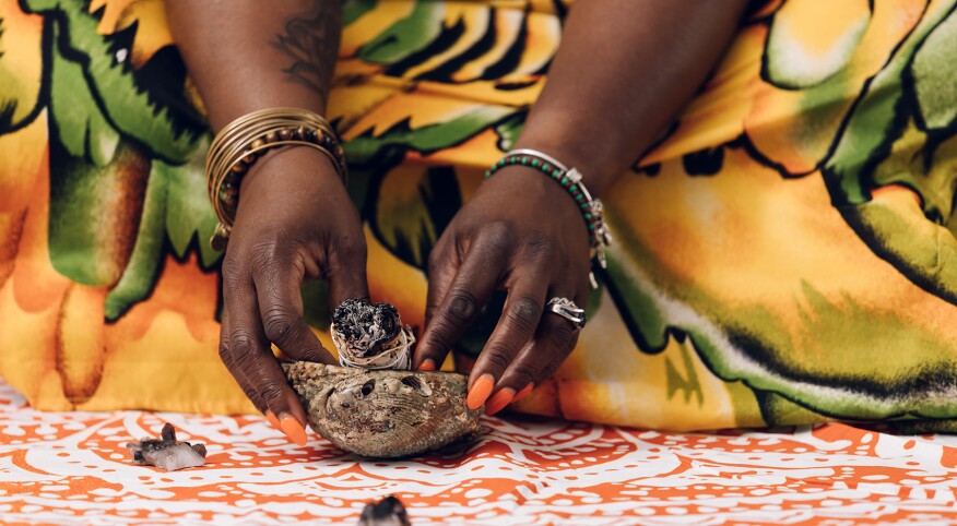 image_of_womans_hand_holding_sage_GettyImages-1179688398_1800