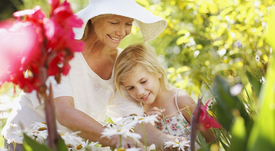 two people in garden with flowers