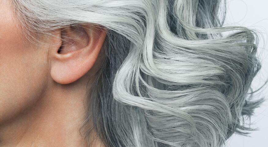 Grey haired woman profile, cropped.