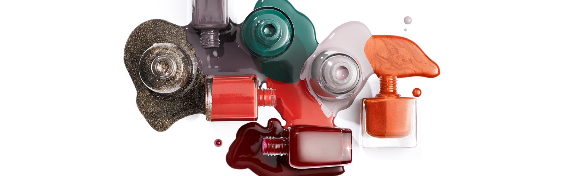 collage of different nail polishes spilling over