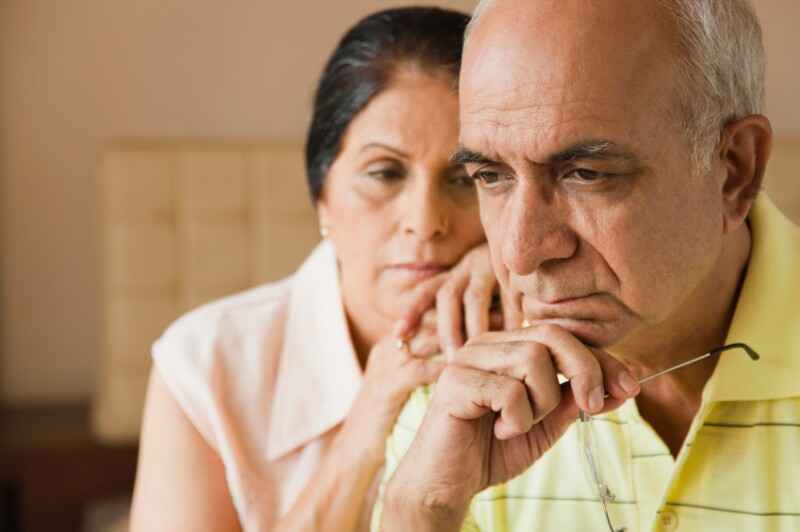 Pensive older couple