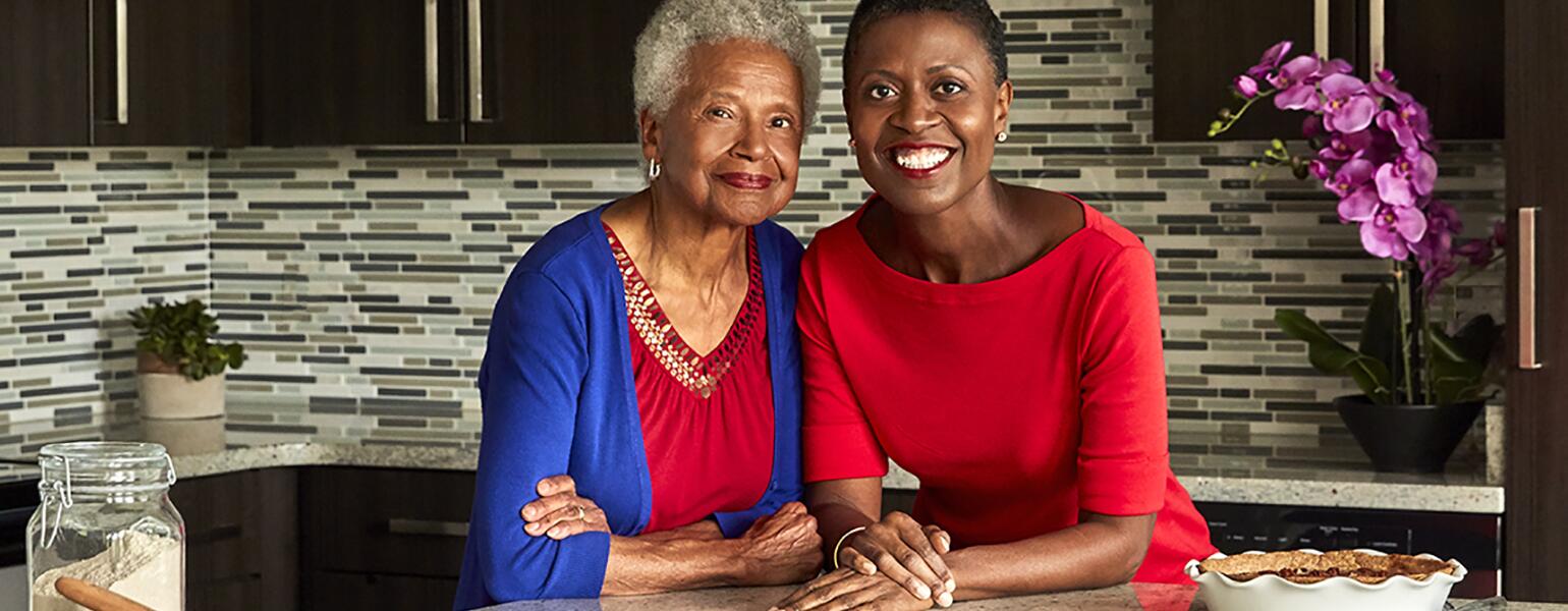 Mother and daughter in kitchen with a pecan pie