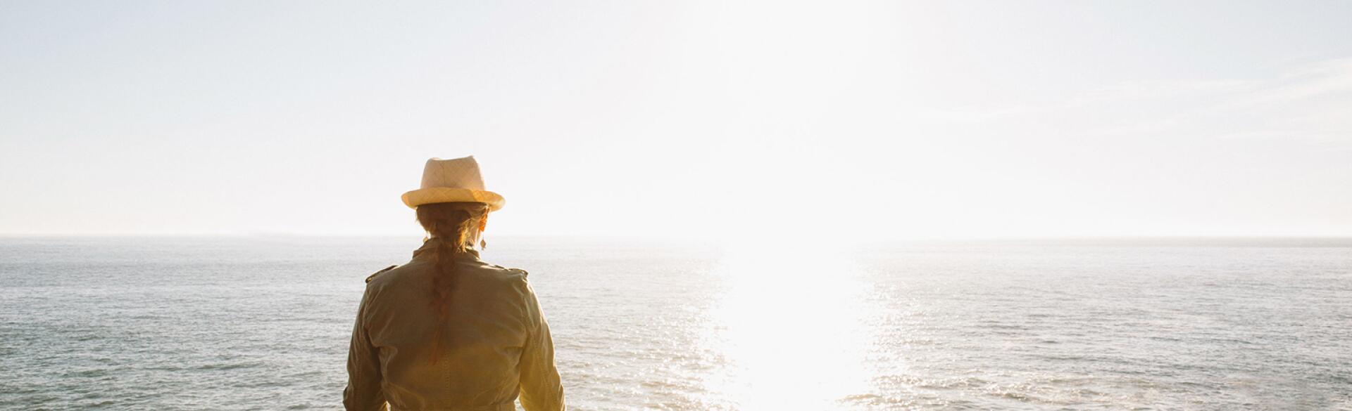 Woman Meditating In Nature By Ocean