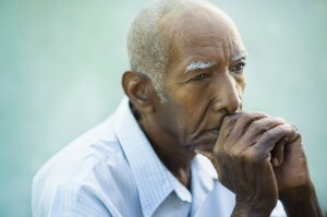 Portrait of sad bald senior man