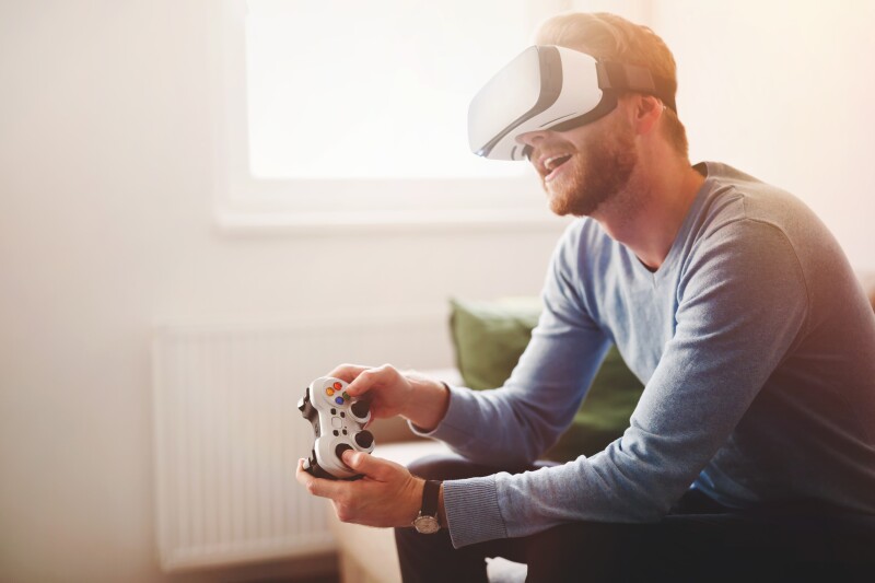 Handsome man enjoying games and vr