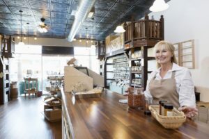 Spice merchant standing at counter of her store