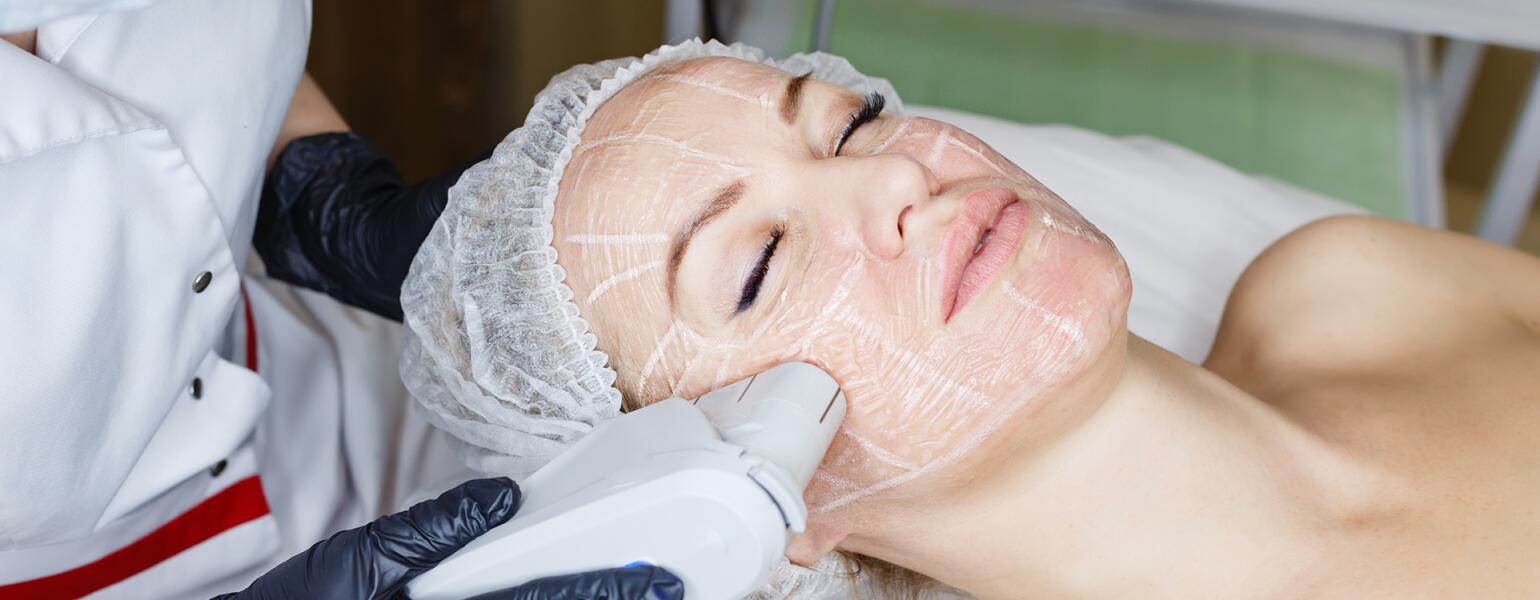 A photo of a woman undergoing an ultherapy treatment.