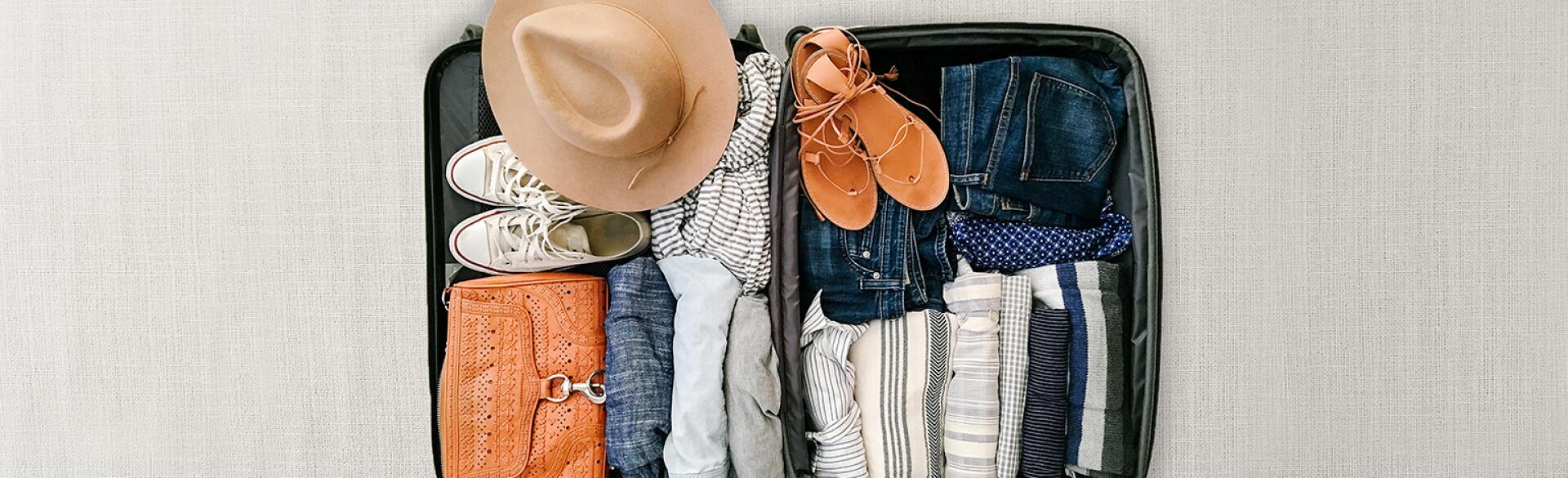 image of open suitcase neatly packed