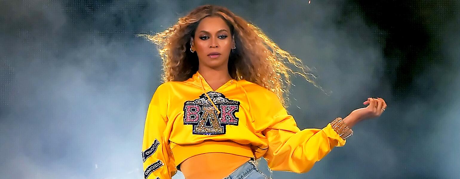 Beyonce performing at Coachella wearing college sweatshirt