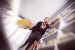 Office worker screams in sheer terror as she slips off a ladder.