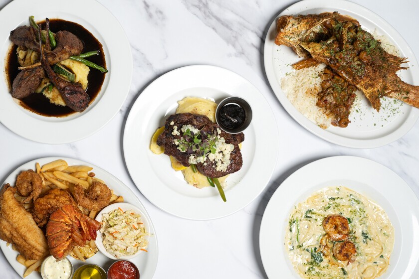 An overhead view of various entrees at Savoy in Detroit, Missouri 