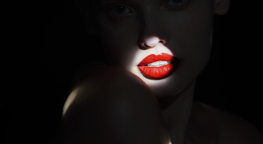 Spotlight on woman with red lipstick