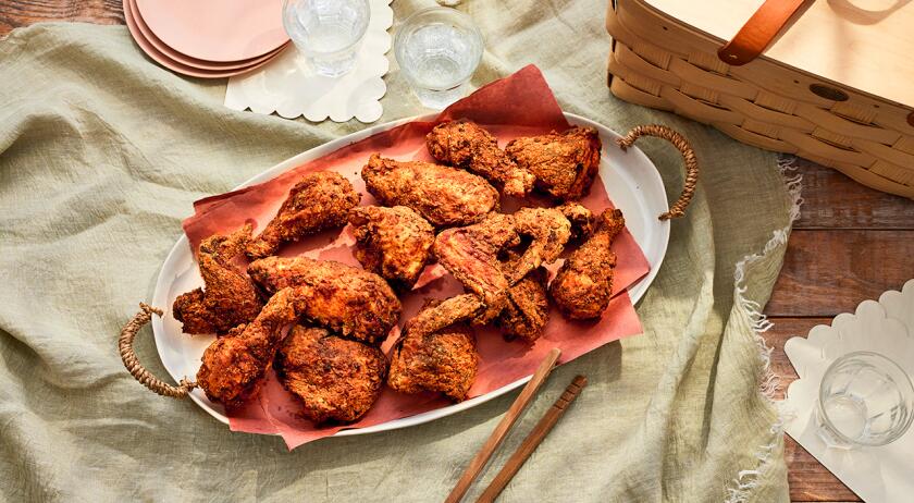 Platter of fried chicken on light surface