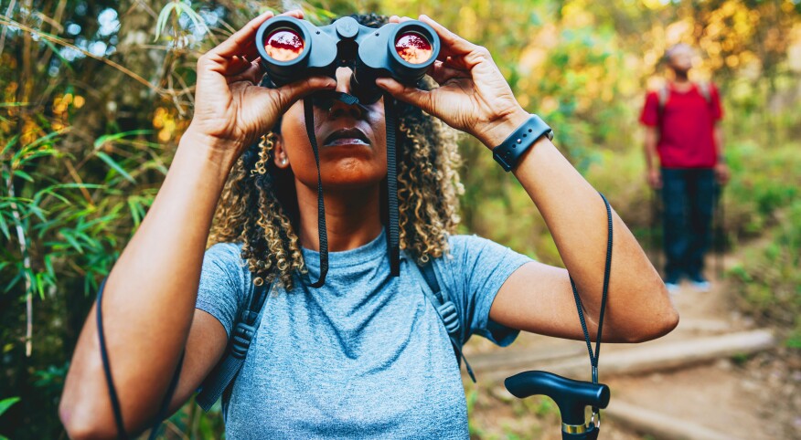 Black woman birdwatching