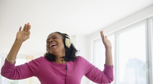 image_of_woman_with_headphones_singing_GettyImages-514411047_1800
