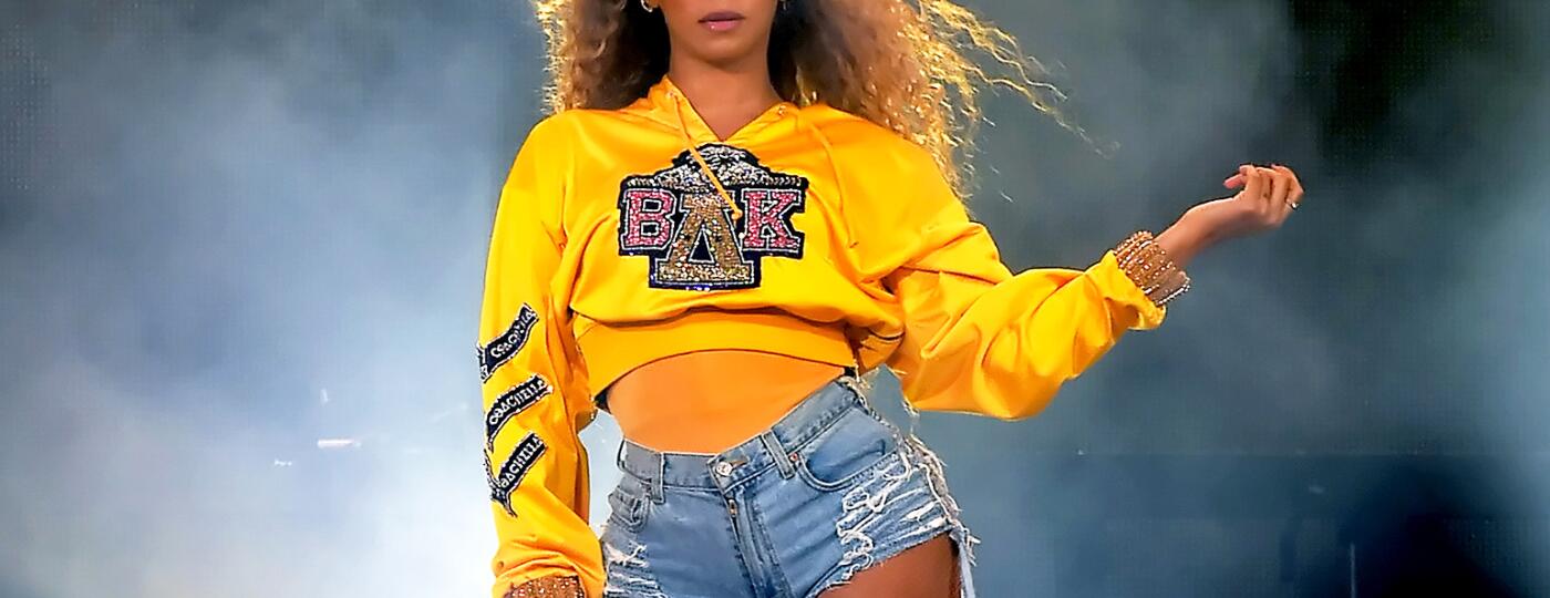 Beyonce performing at Coachella wearing college sweatshirt