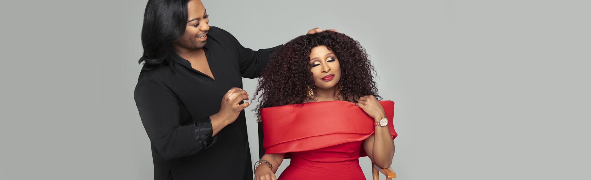Woman getting fitted for wig by stylist