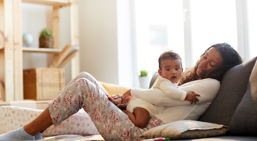 image_of_mother_holding_baby_GettyImages-1152209557_1540.jpg