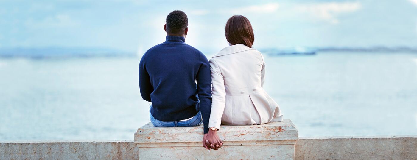 image_of_couple_from_behind_holding_hands_GettyImages-947725718_extension_1540.jpg