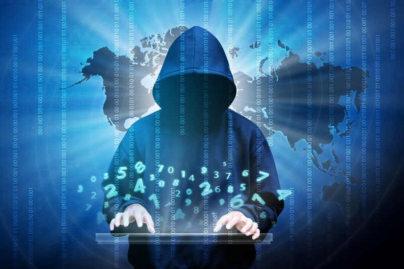 Computer hacker silhouette of hooded man