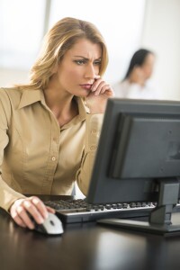 Woman using desktop computer