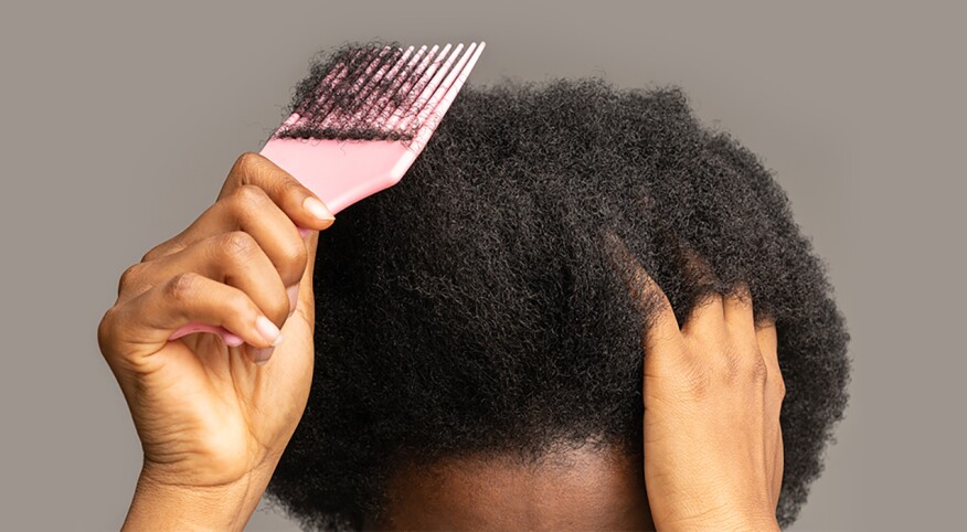 image_of_afro_hair_picked_with_comb_GettyImages-1334542316_1440x560_1800