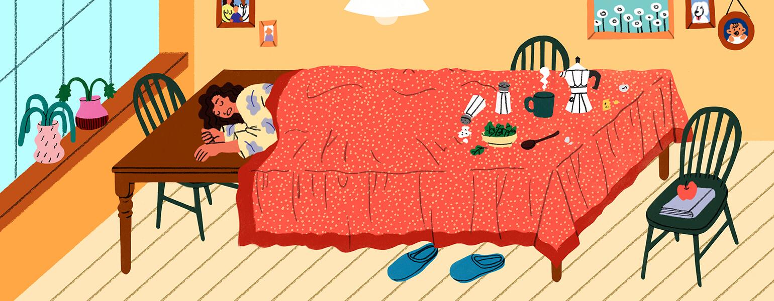 An extremely fatigued woman sleeps on her dining room table under a tablecloth.