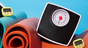 Yoga mats, bathroom scales and timers in a still-life