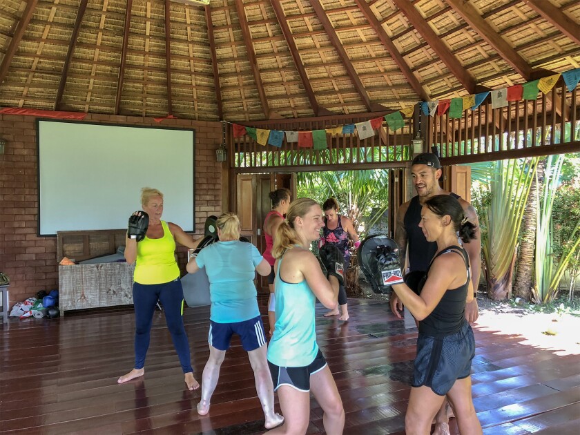 Women participate in a boxing class offered at G.I. Jane Bootcamp.