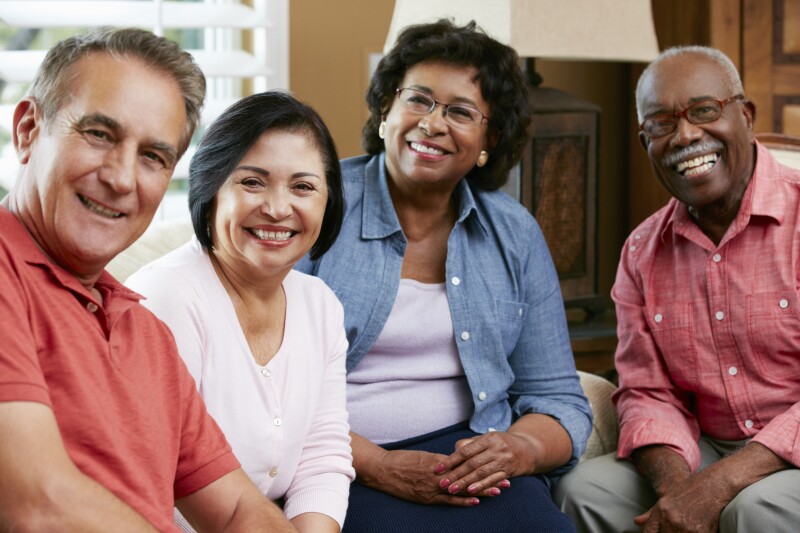 Portrait Of Senior Friends At Home Together