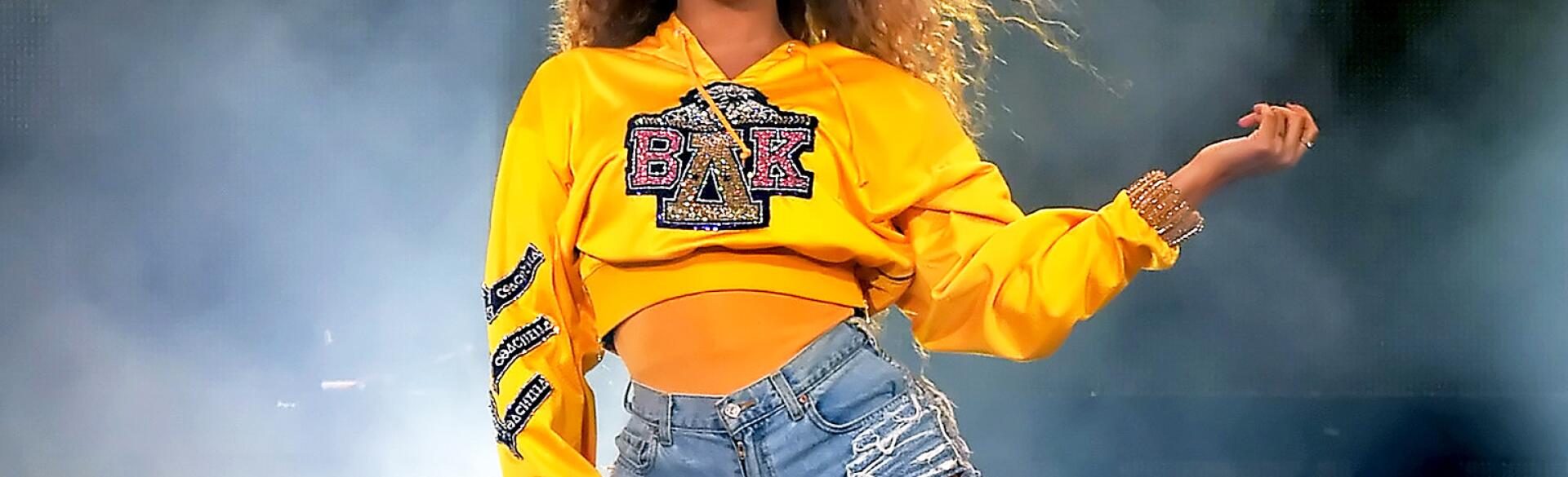 Beyonce performing at Coachella wearing college sweatshirt