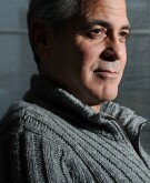 George Clooney poses for a portrait wearing a grey sweater at the Carlyle, a Rosewood Hotel on Wednesday February 05, 2014 in New York, NY