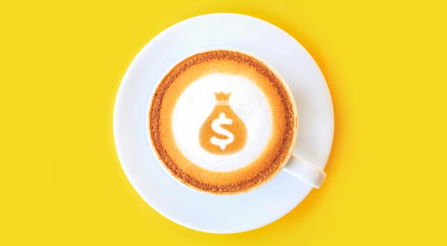 latte with dollar sign and money bag made out of the foam