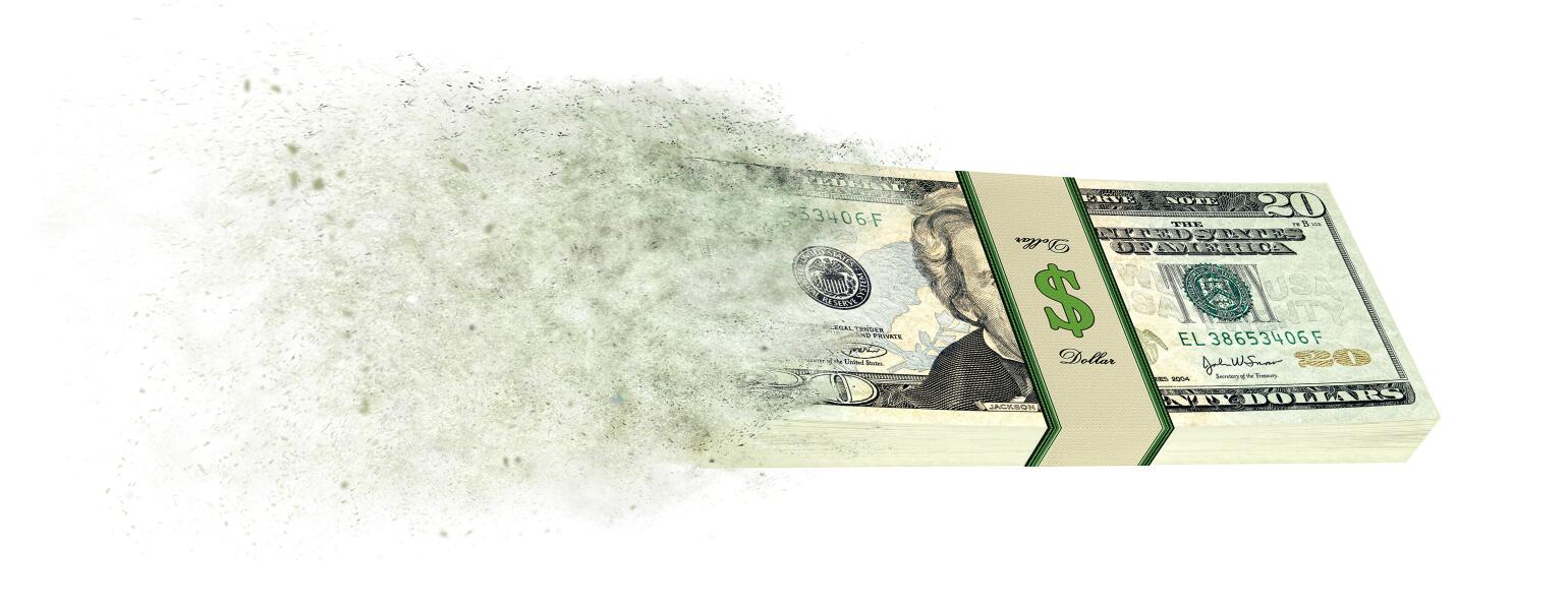 Stack of 20 dollar bills going up in smoke