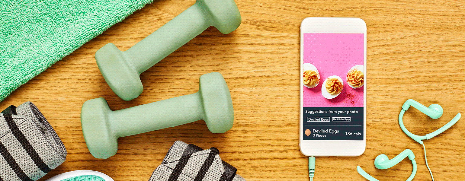 gif of workout items and phone with lose it app screenshots