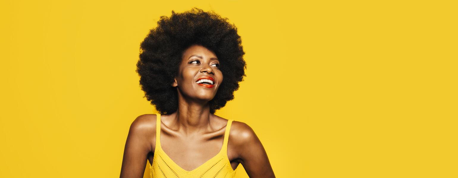 Woman smiling with healthy hair.
