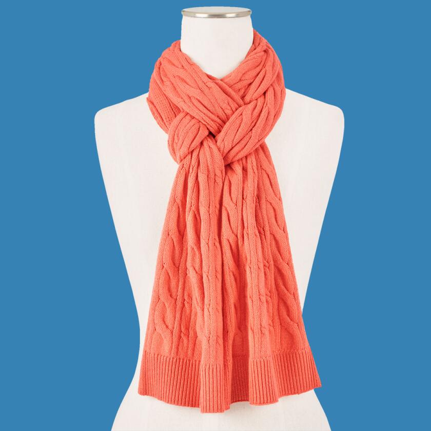 Orange cable knit scarf on bust mannequin