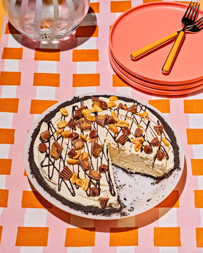 Overhead photo of frozen peanut butter pie on bright orange background