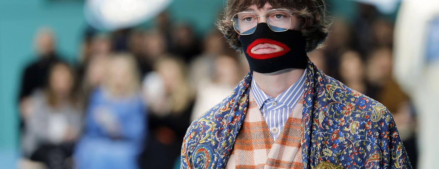 A photo of a model from the Gucci fashion show, featuring a face warmer made to resemble blackface.