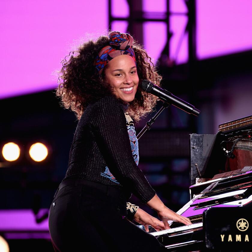 Alicia Keys Portrait of her playing piano