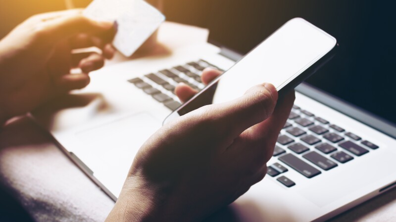 Woman using smartphone and login internet banking for shopping online.