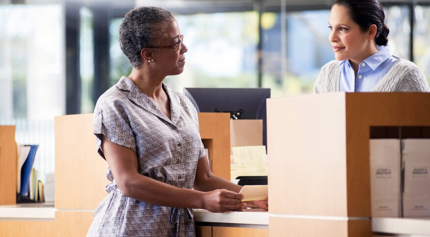 image_of_woman_at_bank_GettyImages-173289629_1800