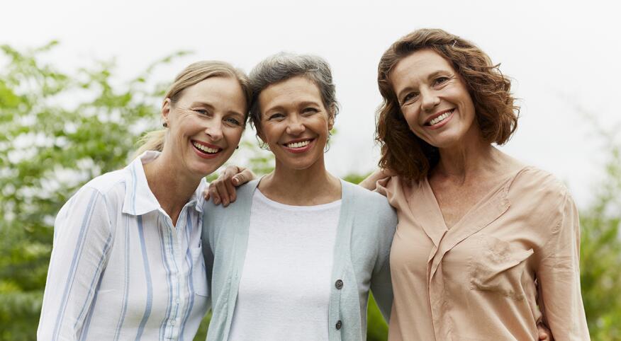 three women looking at camera