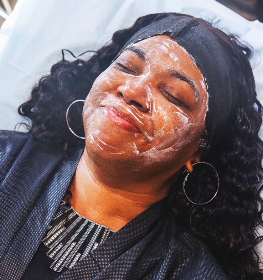 A client of J. Elite Esthetics during her microneedling session