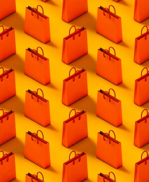 Pattern of red-orange shopping bag on a yellow background