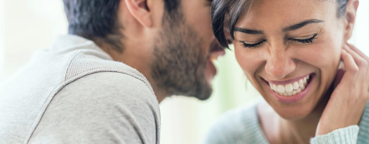 An image depicting a man over 40 speaking with a woman.