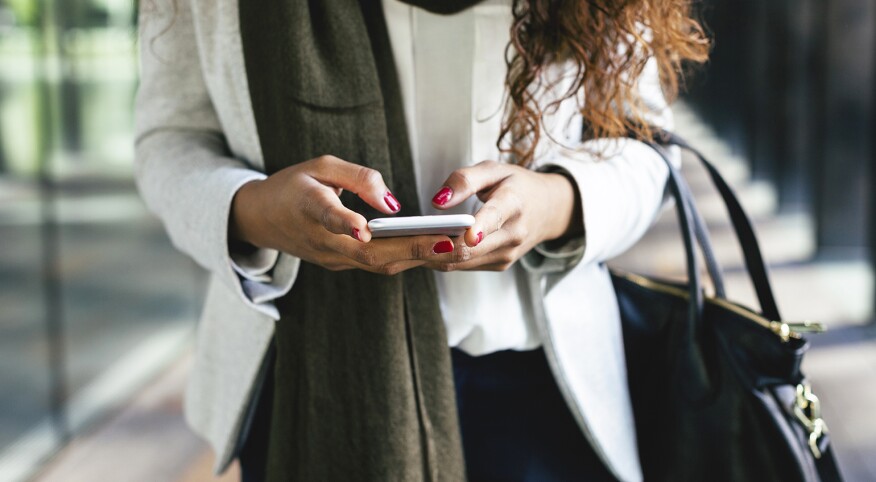 image_of_woman_hands_using_phone_offset_comp_300588_1540