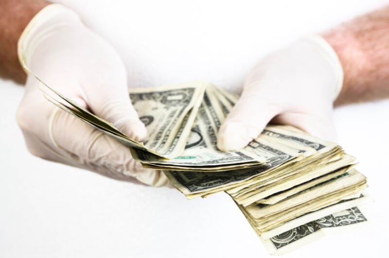 Money: Handling dollar bills iStock_000010885687Small.jpg