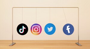 image of social media icons hanging from pole, instagram, tiktok, twitter, facebook, social life, communication
